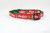 Red and green Christmas cat collar with the words "Naughty" and "Nice" printed on it.