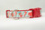 Holiday collar with a white and blue striped pattern with candy canes, red mugs and red coffee cups with snowflakes. 