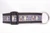 Brown dog collar featuring a cattle skull with flowers, arrows and the text "Wild 'n Free".
