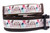 A white dog collar with a colorful print of owls and feathers.