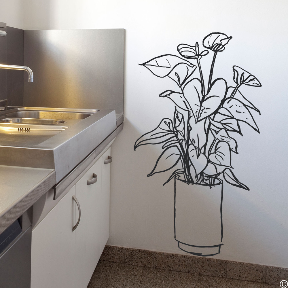 The hand drawn Flamingo Flower plant wall decal placed in a kitchen in black vinyl.