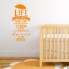 Wall quote "Life isn't about waiting for the storm to pass, it's learning to dance in the rain," vinyl wall decal in persimmon