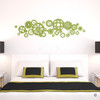 Steampunk Gears Wall Decal above a living room couch  in olive vinyl color