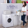 The Laundry Company wall decal quote in orchid vinyl in a laundry room with women doing laundry.