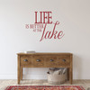 Life is better at the Lake wall decal, on a wall in the dark red vinyl color.