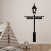 The Gas Lamp wall decal with customizable signs on a playroom wall in black vinyl.