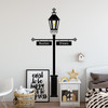 The Gas Lamp wall decal with customizable signs on a bedroom wall in black vinyl.