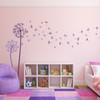 Sample photo of the Freya two color dandelion wall decal in violet and lavender vinyl.