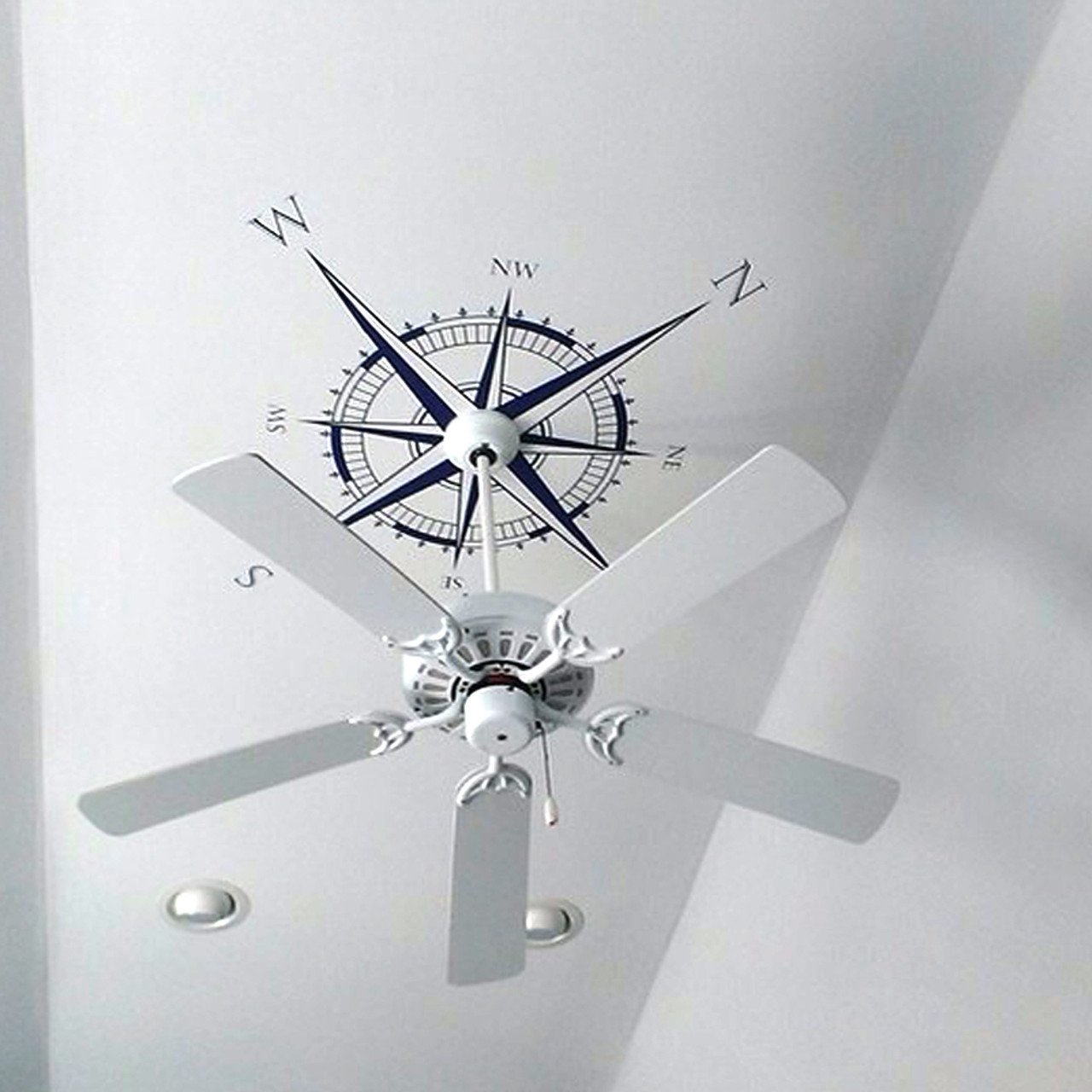 Customer photo of The Explorer Compass wall or ceiling decal shown here in dark blue vinyl.