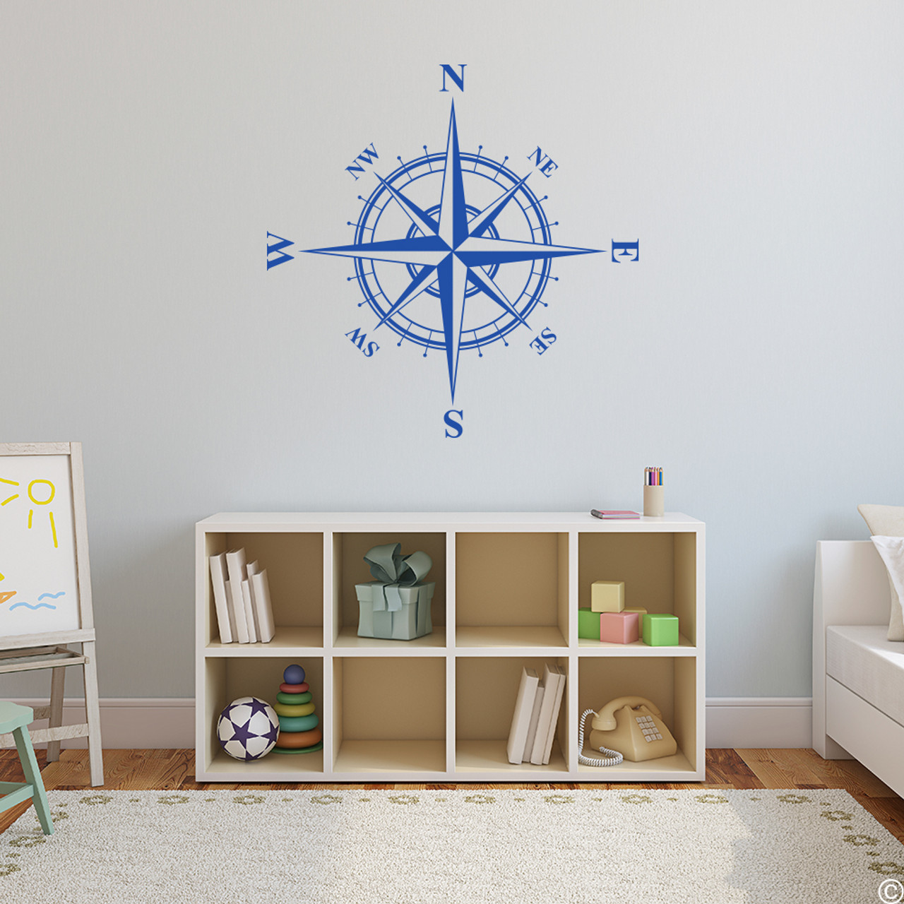 The Charles compass wall decal shown here in traffic blue vinyl.