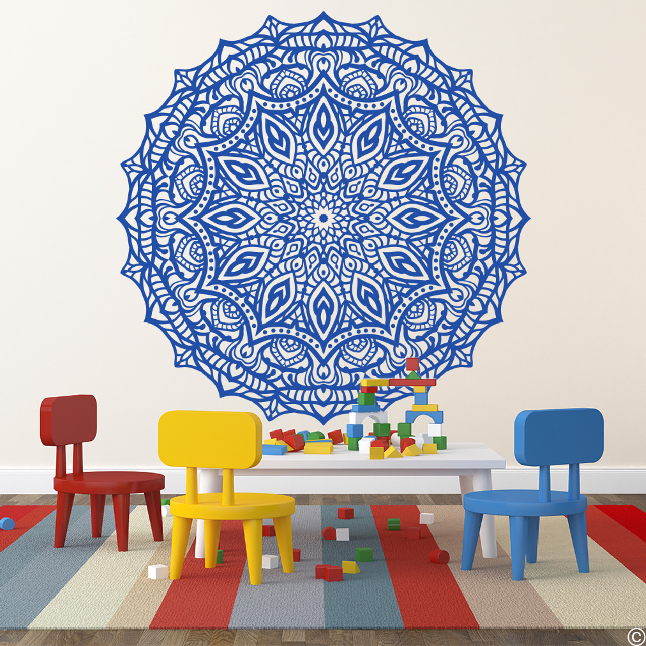 The Celandine Mandala vinyl wall decal in traffic blue