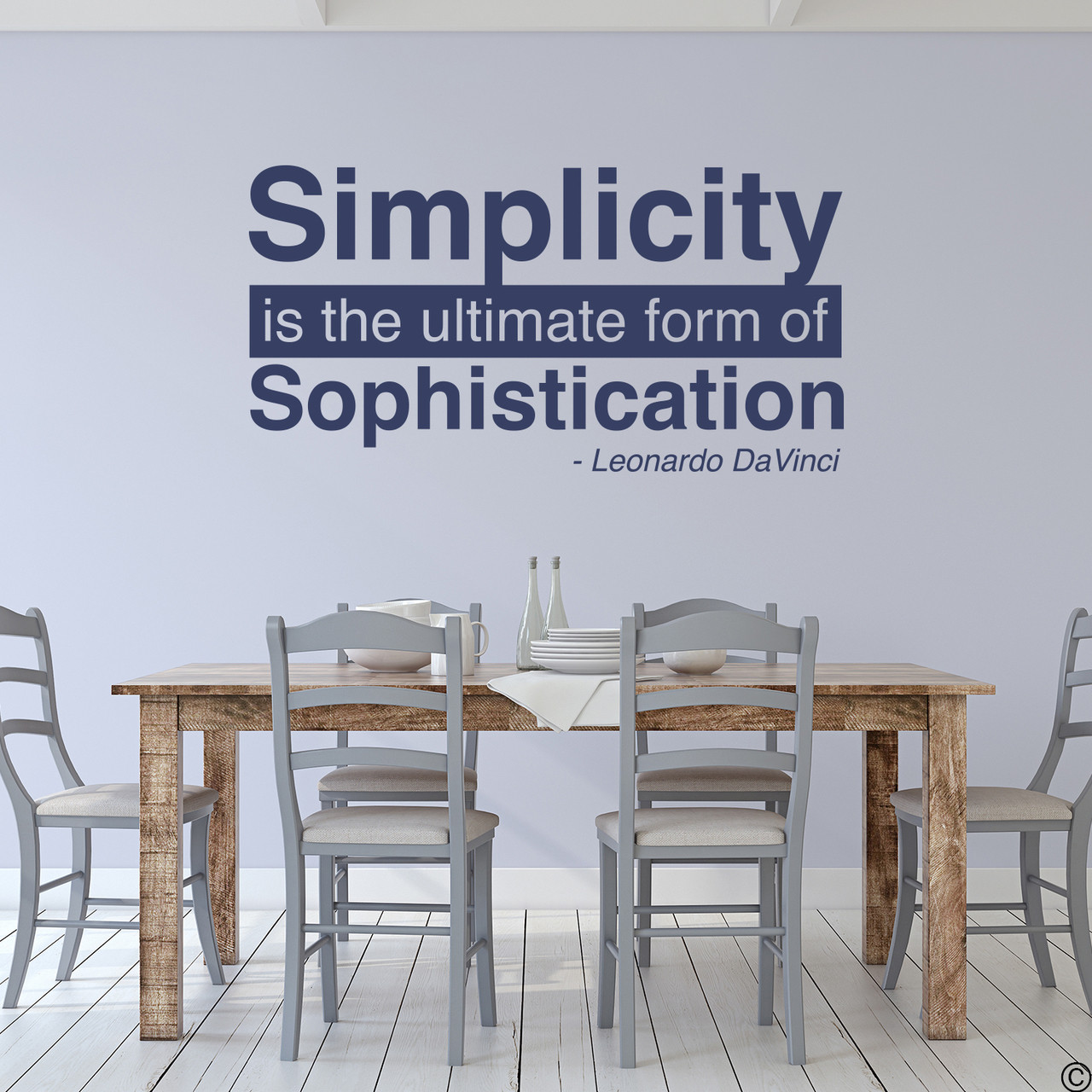 A famous Leonardo DaVinci wall decal quote of "Simplicity is the ultimate form of Sophistication." Shown here in dark blue vinyl and with modern kitchen home decor. 
