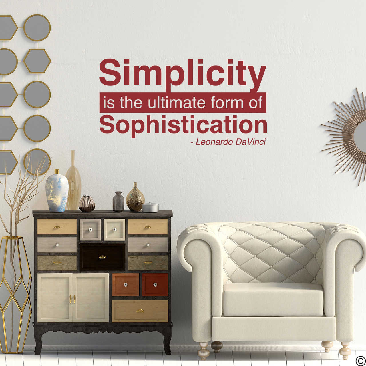 A famous Leonardo DaVinci wall decal quote of "Simplicity is the ultimate form of Sophistication." Shown here in dark red vinyl and with modern living room home decor. 