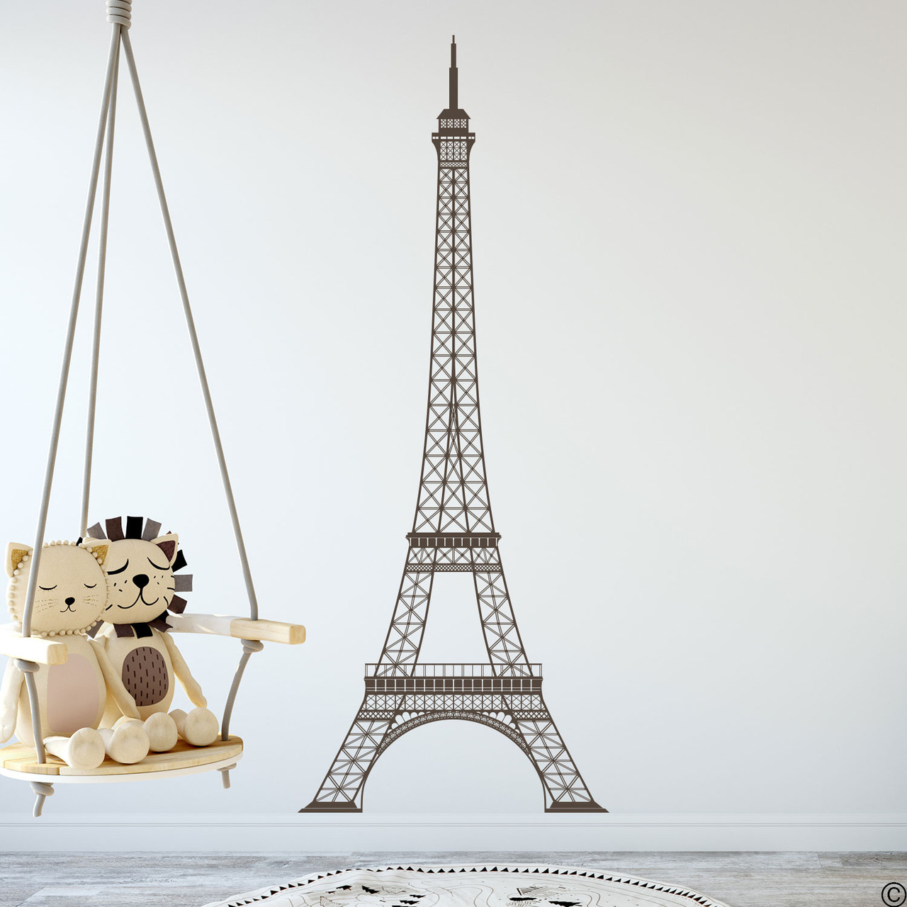 The Eiffel Tower wall decal shown here in brown color on an interior playroom wall.