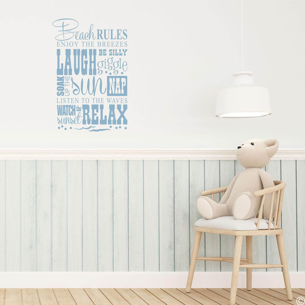 The Beach Rules wall decal on a wall in the limited edition misty blue vinyl color.