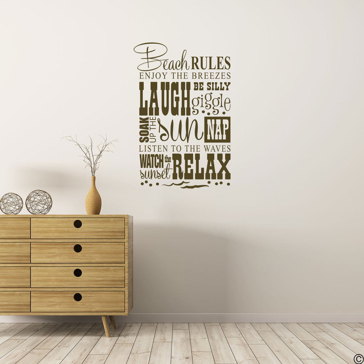 The Beach Rules wall decal on a wall in the nougat brown vinyl color.