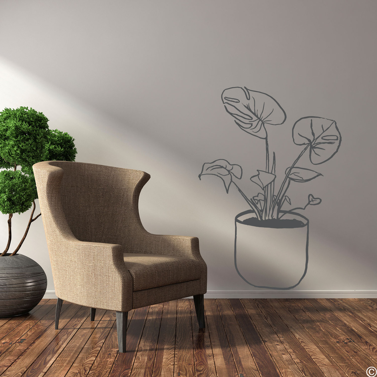 The hand drawn Swiss cheese potted plant wall decal in dark grey vinyl.