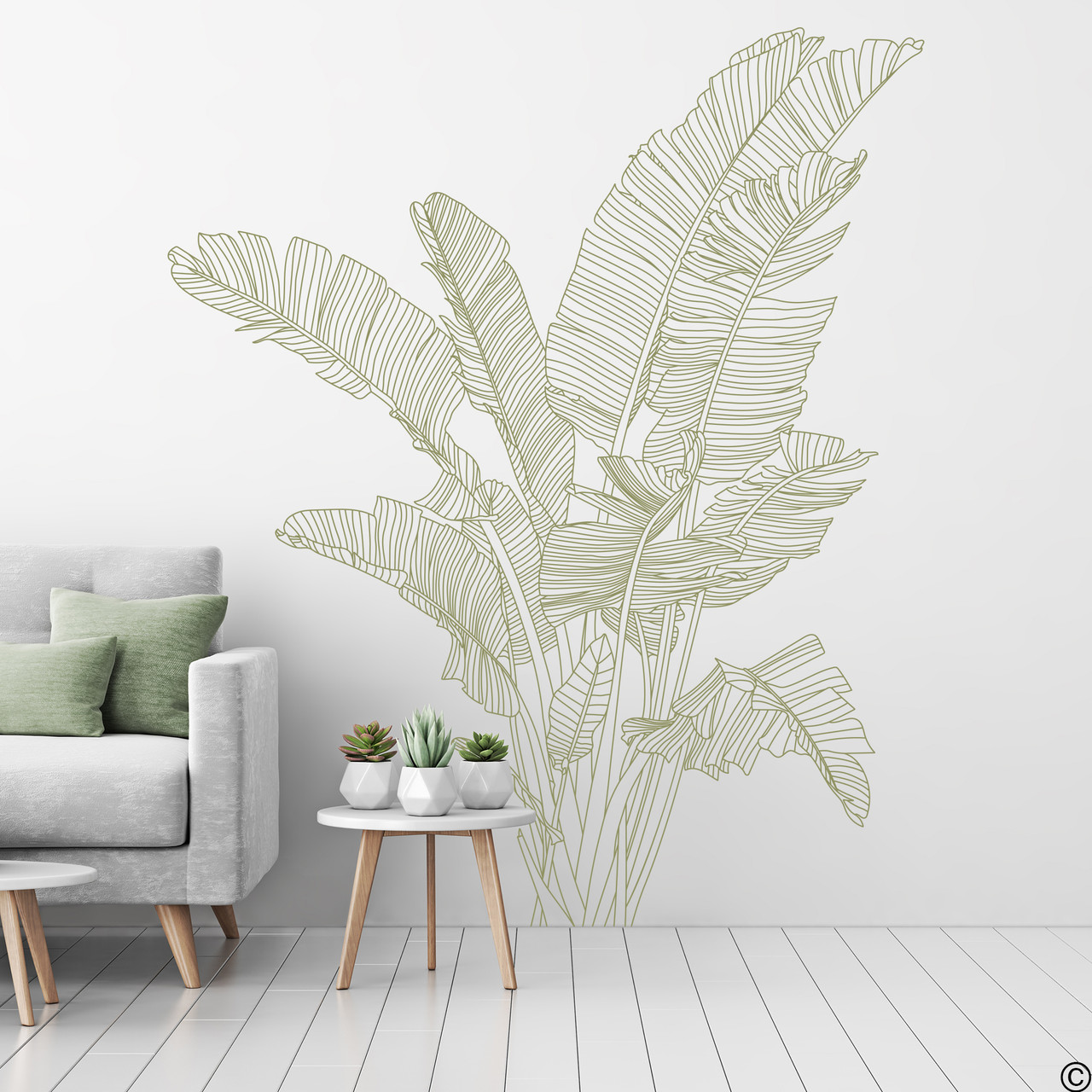 The Bird of Paradise wall decal shown here in celadon vinyl color on a living room wall.