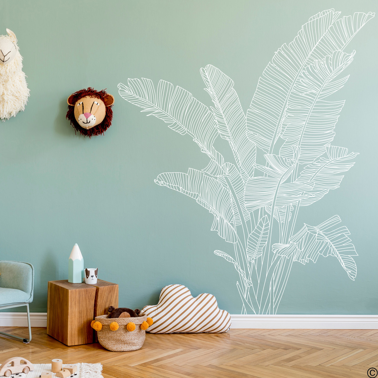 The Bird of Paradise wall decal shown here in white vinyl color on a nursery room wall.