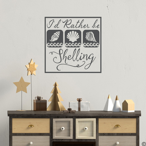 "I'd Rather Be Shelling," wall decal quote with seashell images. Shown here in dark grey color.