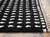 Minston - Black/White - 5' x 7' Rug (R405952) by Ashley