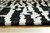 Bramshaw - Black/Ivory - Large Rug (R406761) by Ashley