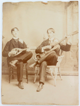 LARGE 1897 PHOTO OF 2 YOUNG MEN PLAYING MUSICAL INSTRUMENTS. AMERICANA !! 