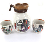 DECORATIVE JAPANESE 3 PIECE POTTERY SAKE SET.