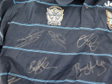 GOLD COAST TITANS SIGNED SUPPORTERS SHIRT. 12 SIGNATURES.