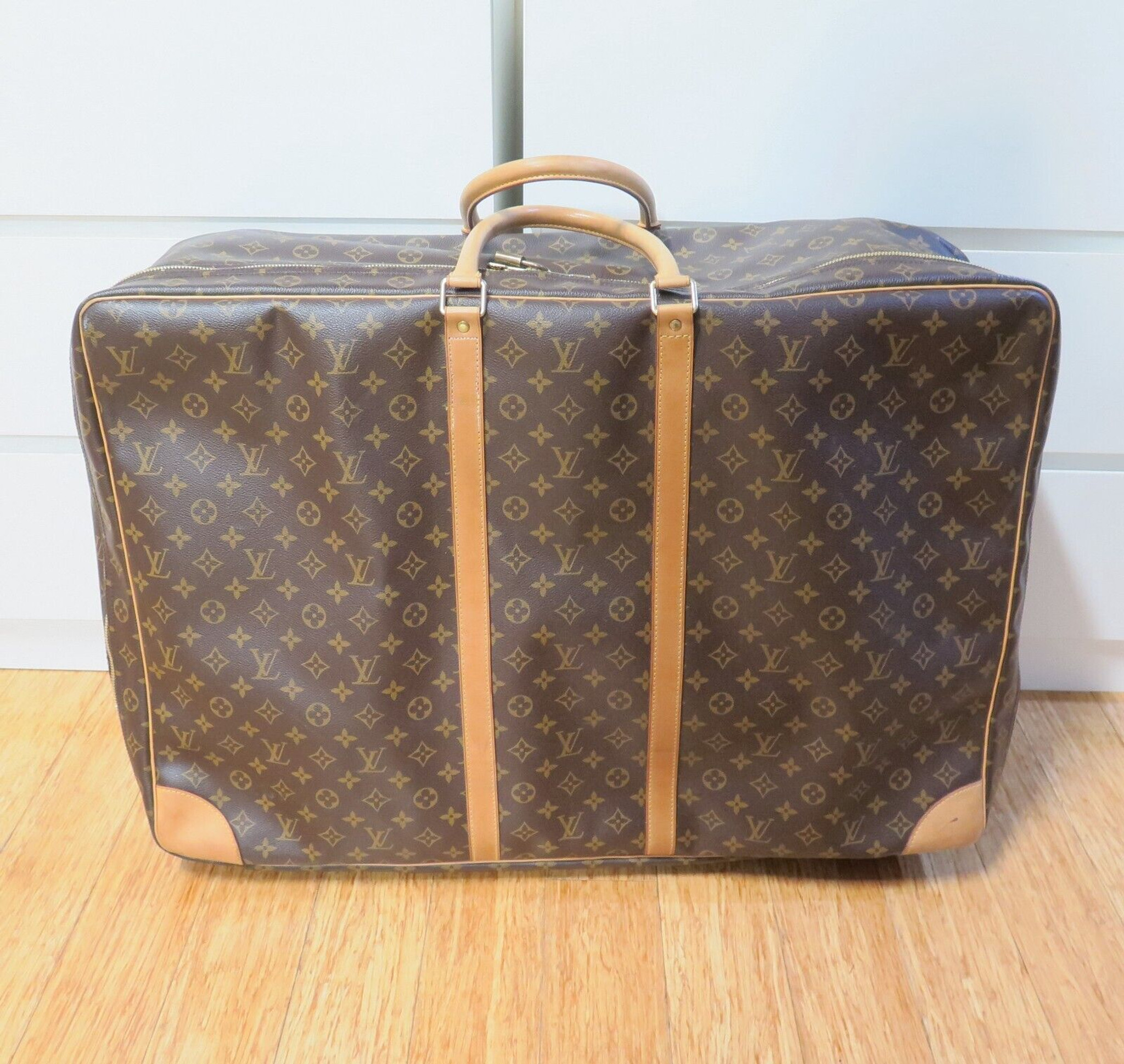 Sold at Auction: Two Louis Vuitton Monogram Canvas and Leather Sirius 70 Soft  Suitcase Luggage Pieces. 70 x 48cm. In good condition but please see  photos. Ref: 10563