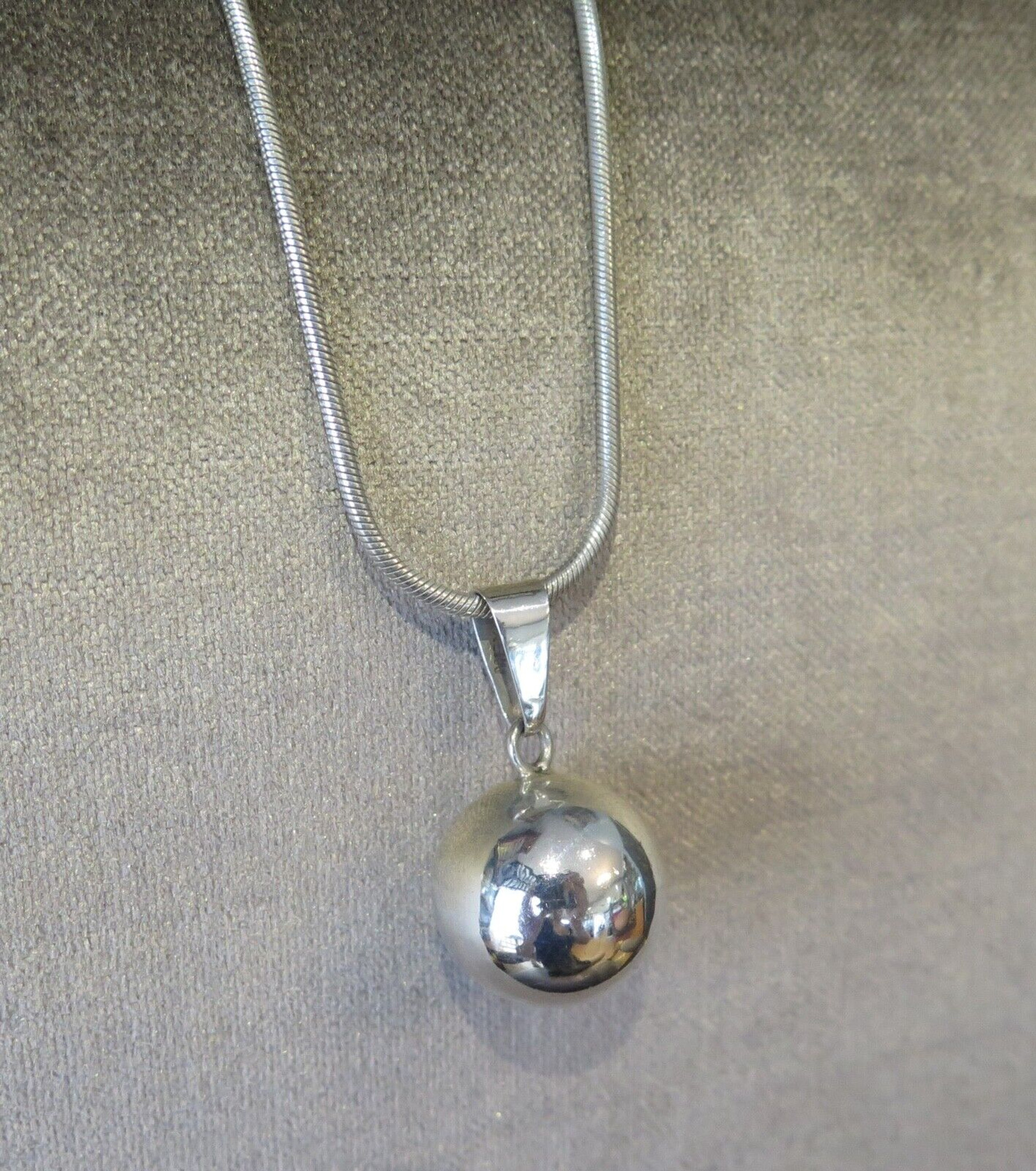 NOVICA Happy Chime Silver and Black Enamel Harmony Ball Necklace with Onyx  | GreaterGood