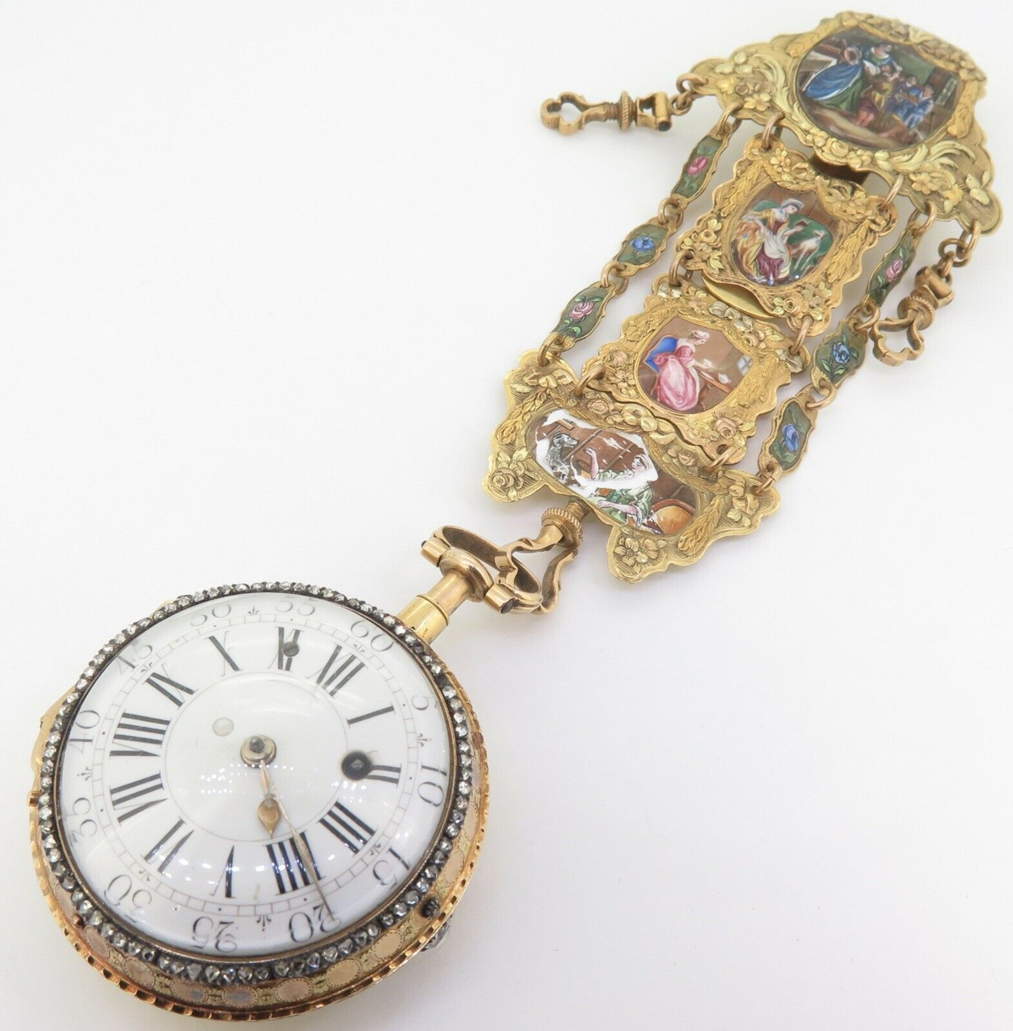 Watch with chatelaine, Golden watch with chatelaine. The hands are set with  diamonds. The front and back is decorated with translucent enamel on an  engraved surface. The chatelaine consists of 3 chains