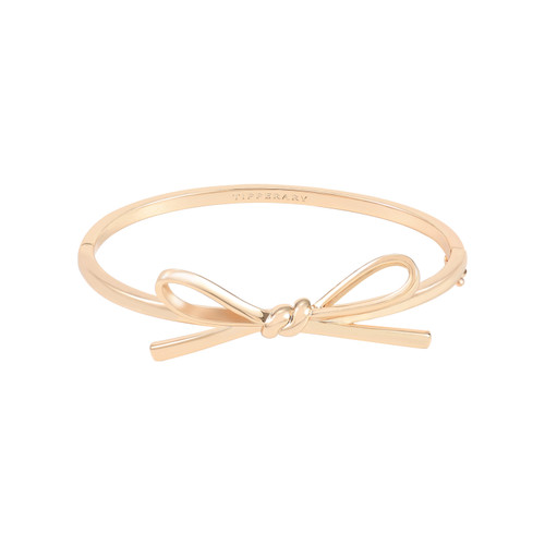 Gold bangle bracelet with a bow design, 65×50 mm inner diameter. Gold bangle bracelet with a bow design, 65×50 mm inner diameter.