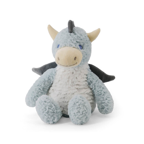 A soft, plush toy shaped like a blue-gray dragon. The dragon is sitting and facing forward, with light horns, small dark wings, and a ridged back. It has a stitched smile and bright blue eyes.