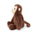 A soft, plush toy shaped like a monkey. The monkey is sitting in a three-quarter profile, looking to the left. It has a long tail, a tan face, and brown, fuzzy ears.