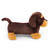 A side profile of the plush dachshund dog toy, showing its long brown body, tan paws, floppy ear, and curled tail, standing on a white background.