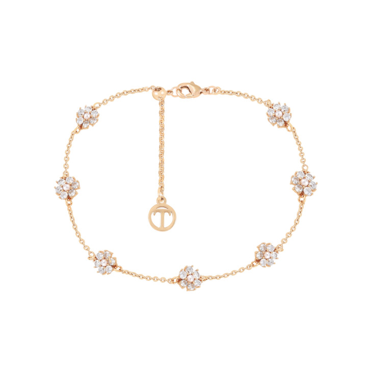 Gold bracelet with sparkling crystal daisy clusters, adjustable chain, and Tipperary Crystal charm.