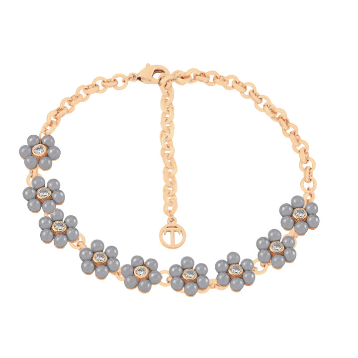 Gold bracelet featuring nine daisy designs with grey pearl petals and crystal centers.