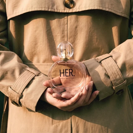 Perfume held in hand