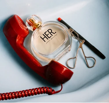 Perfume on a red telephone