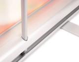 A close-up of a silver pull-up banner stand with a detailed base and pole connection.