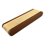 A wooden pen presenter featuring a combination of light and dark wood tones, with a smooth, rounded design.