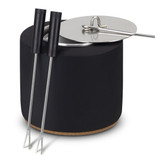 A black keepsake s'mores kit with a cork base, lid, and two stainless steel skewers. A black keepsake s'mores kit with a cork base, lid, and two stainless steel skewers.