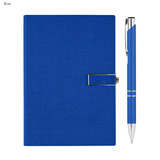 A blue notebook with a textured cover and a silver pen beside it. The notebook features a metal clasp.