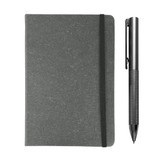 A grey notebook with an elastic strap and a silver pen positioned beside it. Both items feature a logo.