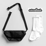 A black fanny pack and a pair of white socks, accompanied by a branding logo.