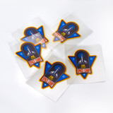 A set of six colourful stickers featuring a space shuttle design with a blue and orange colour scheme.