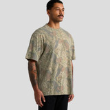 A heavy faded camo tee in shades of green and brown. The shirt has a relaxed fit and features a logo.
