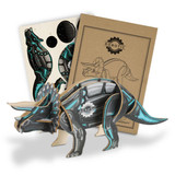 A wooden triceratops model in black and blue, accompanied by design templates and packaging with a logo.