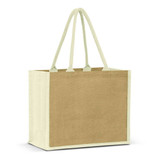A jute tote bag in natural and beige tones, featuring two handles and a blank area for branding. A jute tote bag in natural and beige tones, featuring two handles and a blank area for branding.